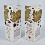 Iepakojums KYRÖ alkoholiskajiem dzērieniem WHISKY OF FIRE un WHISKY OF BLOOD 